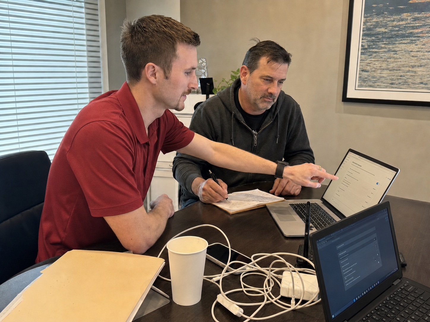 Preston Bessire reviewing new-hire security settings with a small-business owner